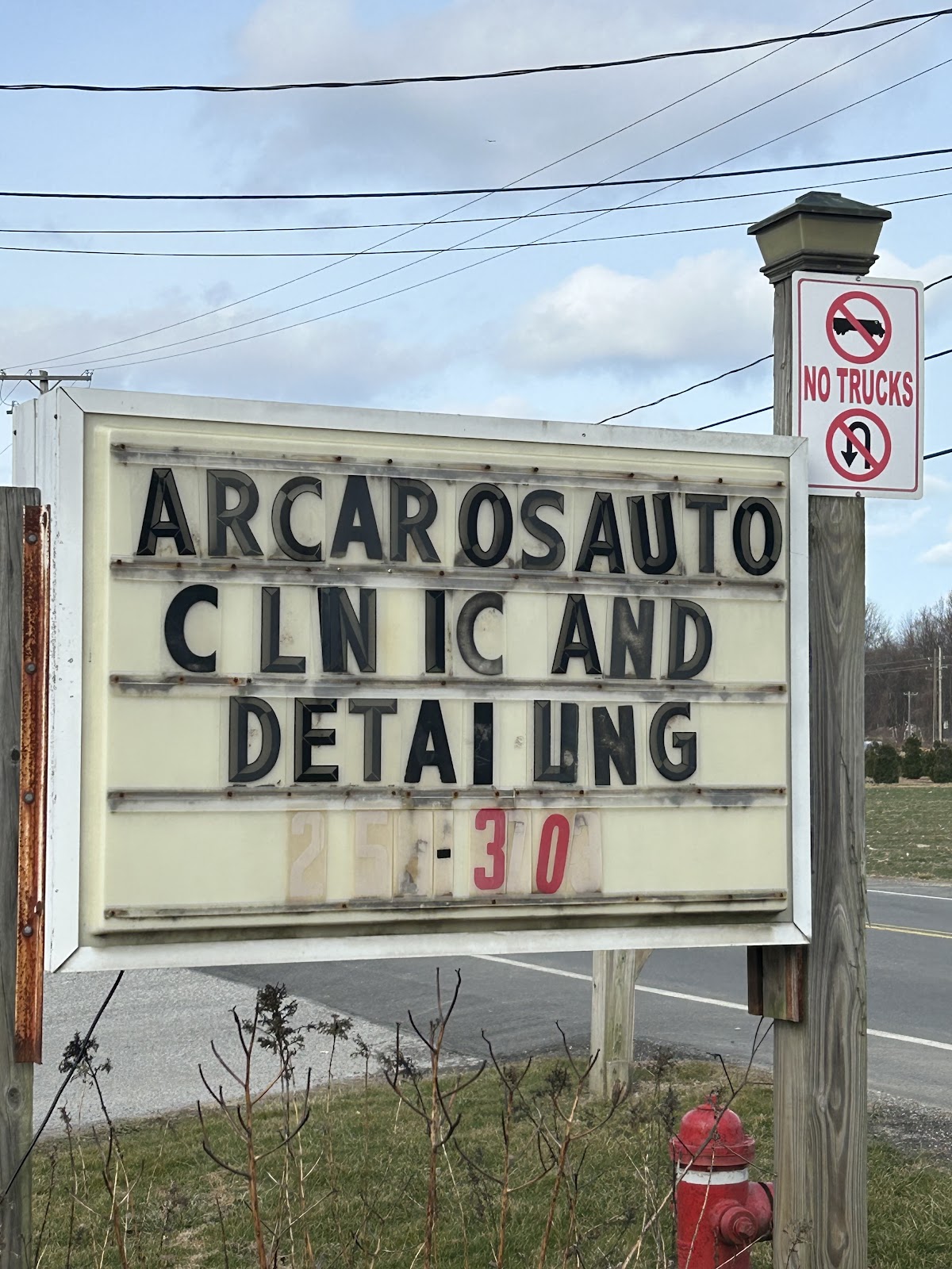 Arcaro's Auto Clinic & Detailing roadside sign in Perry, Ohio
